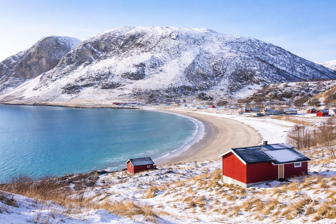 Winter view of Grotfjorden fjord and sandy beach captured on a guided Tromso Norway Tours Arctic excursion