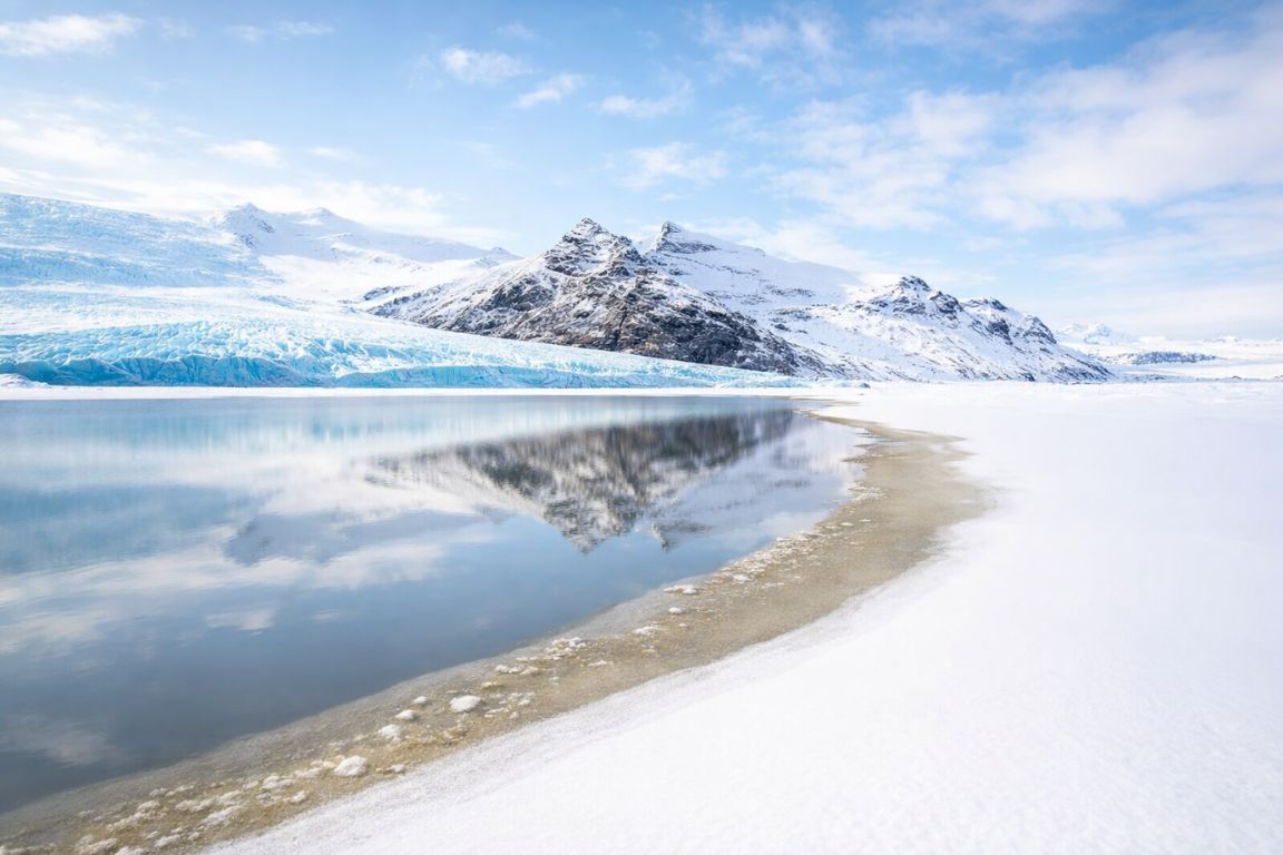 Kvaløya Island Arctic coastline with glacier and snow-covered mountains photographed during a Tromso Norway Tours expedition