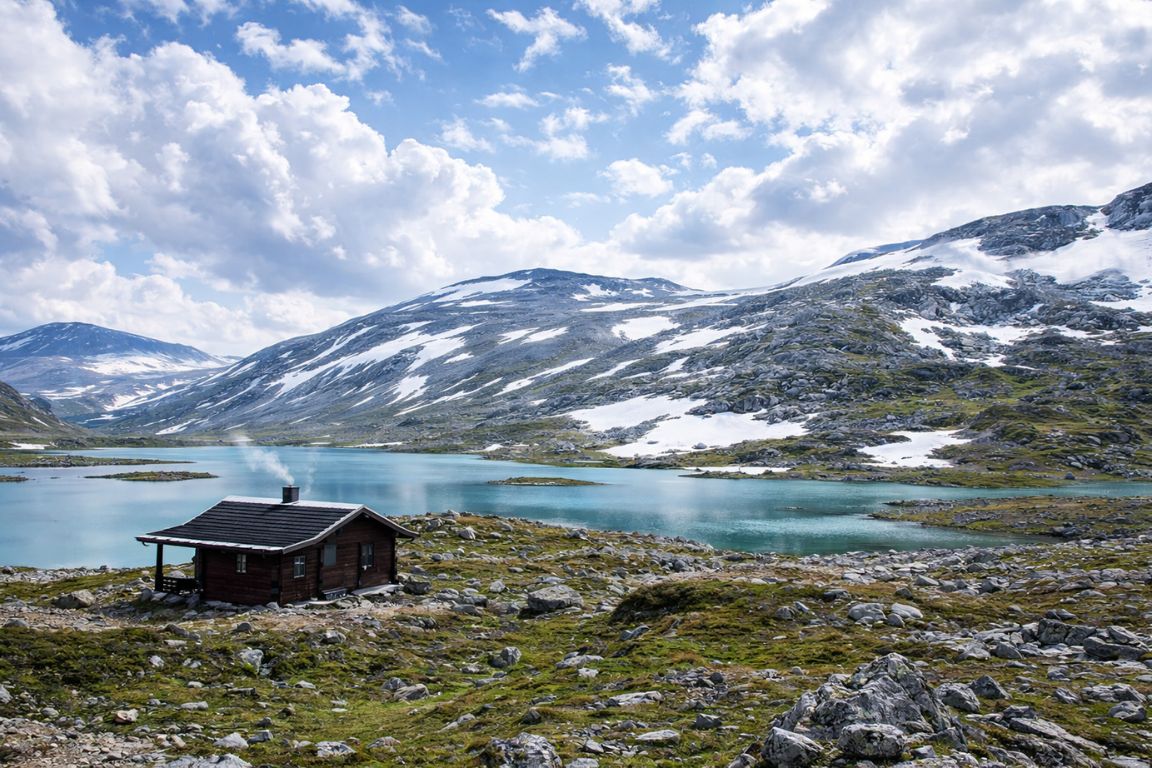 Mountain cabin and turquoise lake in Tromsdalen near Tromsø photographed during a guided tour with Tromso Norway Tours